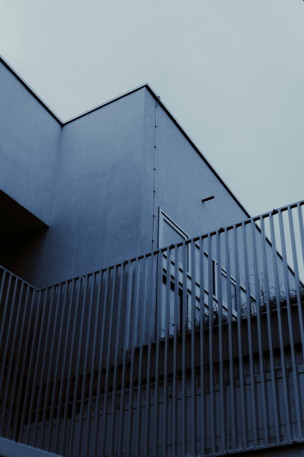 a tall building with a metal fence around it