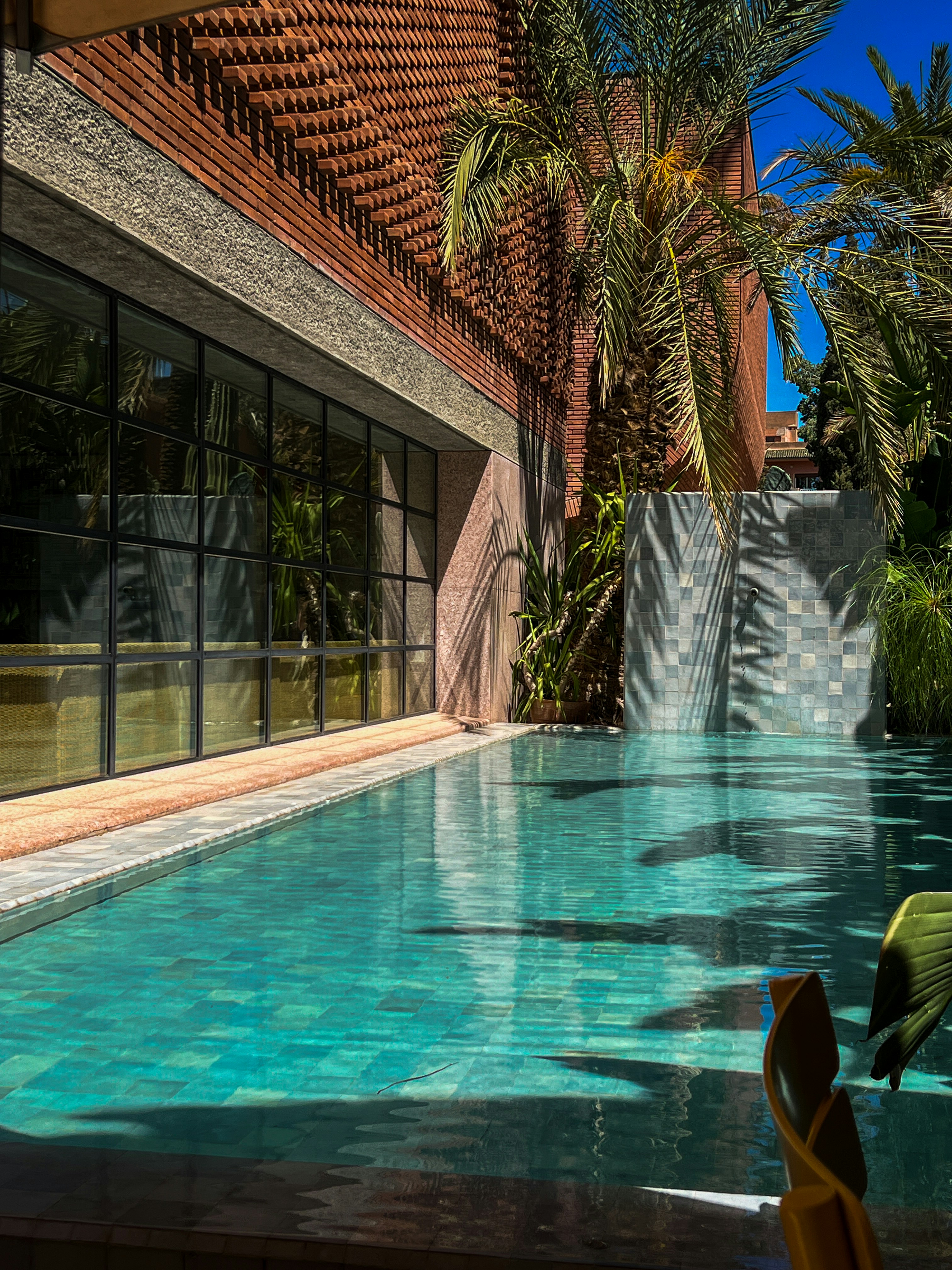 a large swimming pool next to a building