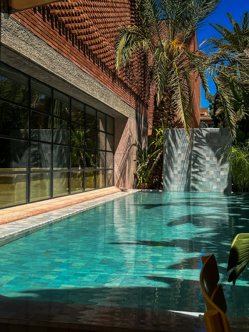 a large swimming pool next to a building