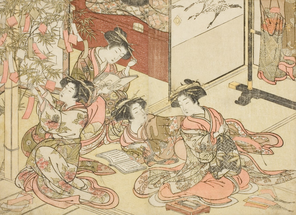 um grupo de mulheres sentadas no chão em frente a um espelho