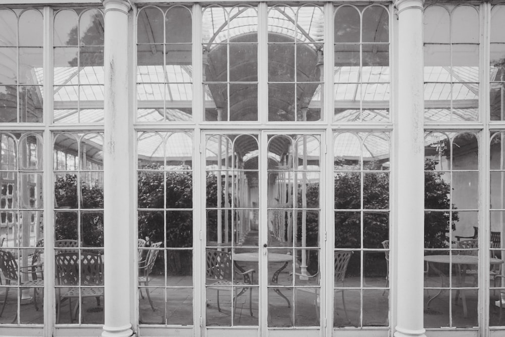 a black and white photo of a glass house