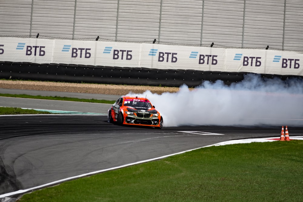 a person driving a car on a race track