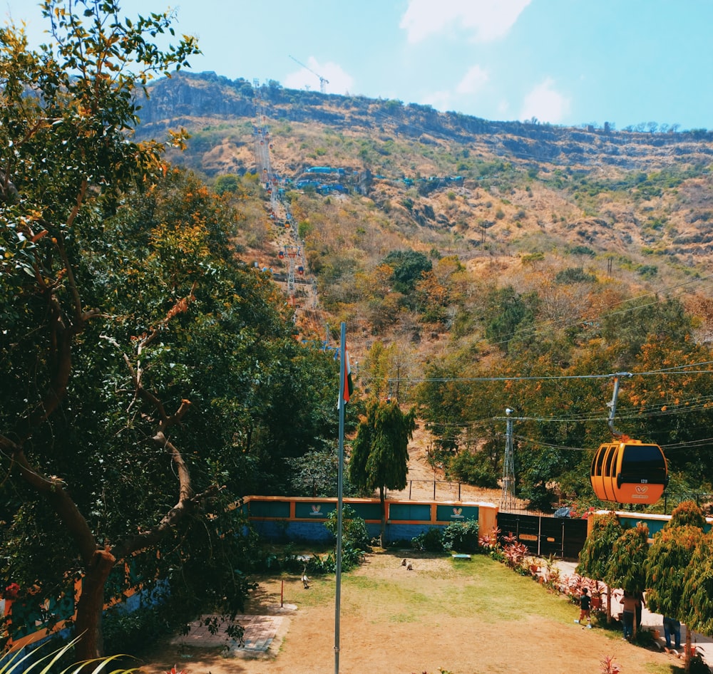 a view of a hillside with a train on the tracks