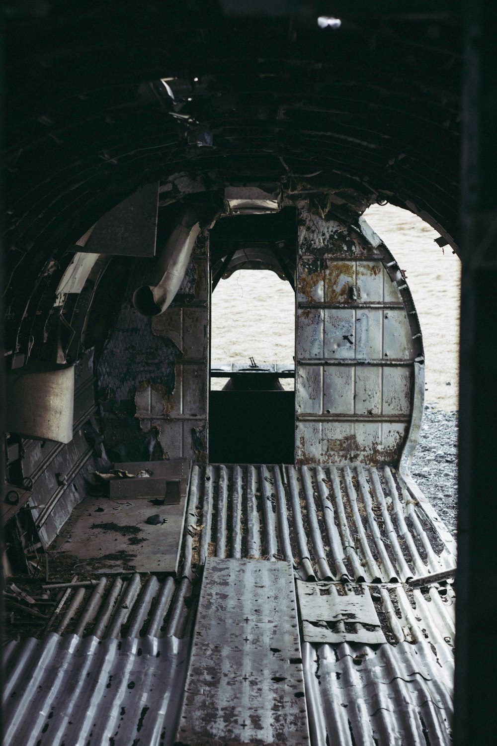the inside of an airplane with a door open