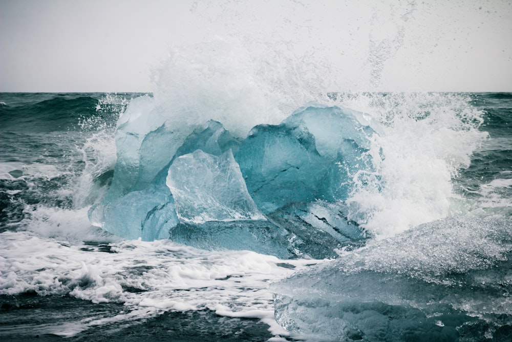 a large iceberg in the middle of the ocean