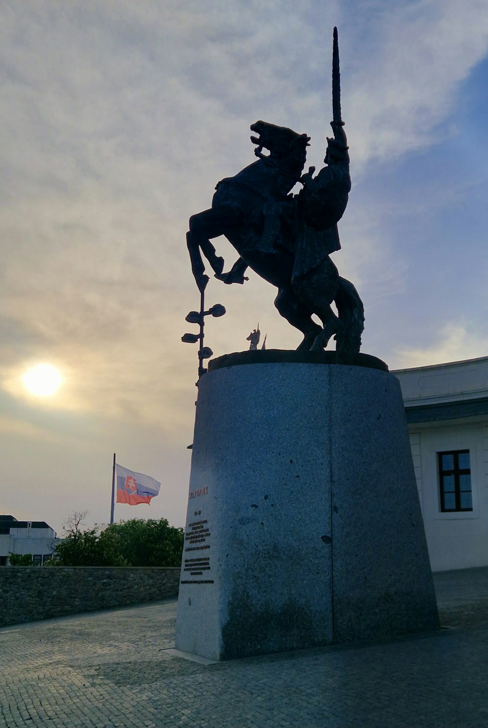 a statue of a man on a horse holding a sword