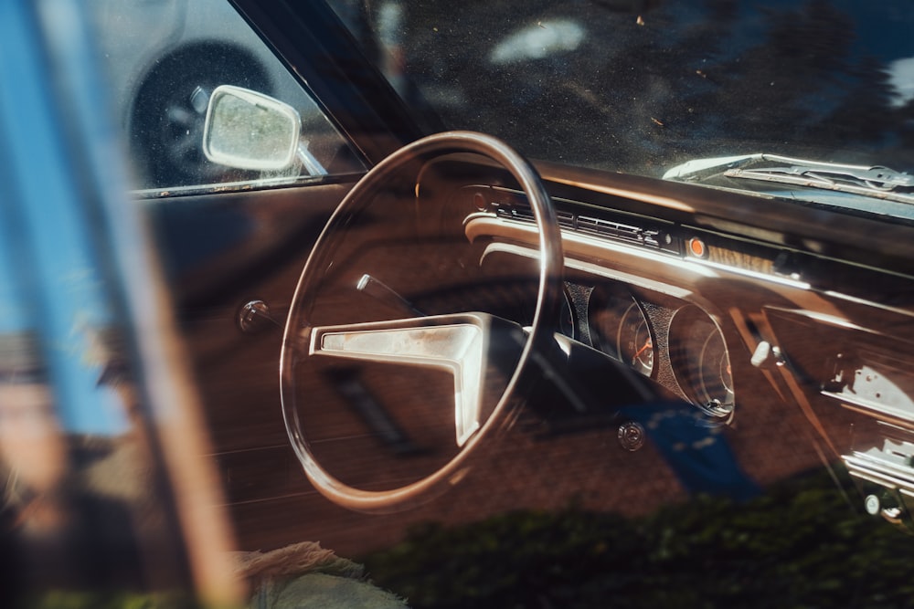 a close up of a car dashboard with a steering wheel