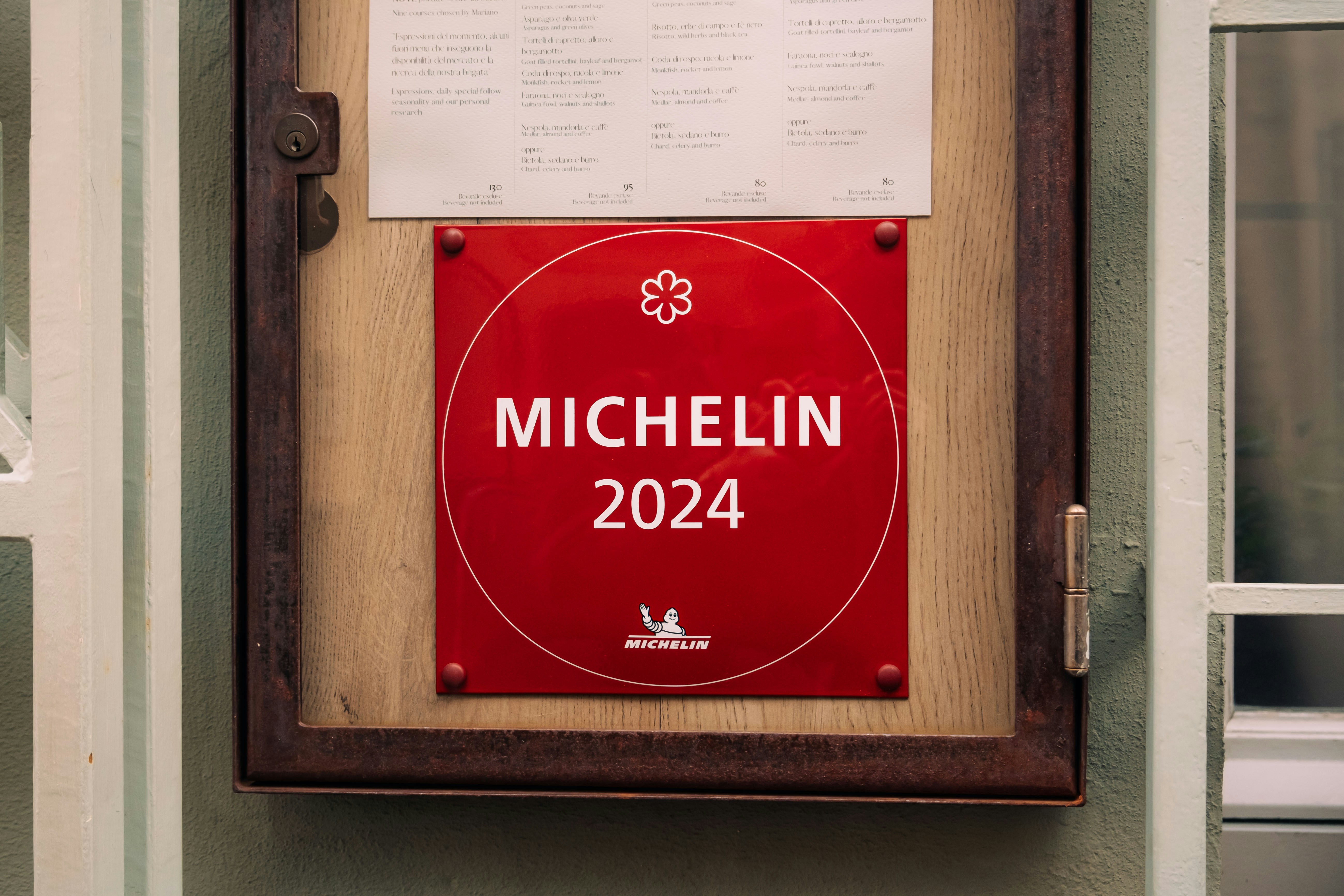 a plaque on a wall that says michelin, 