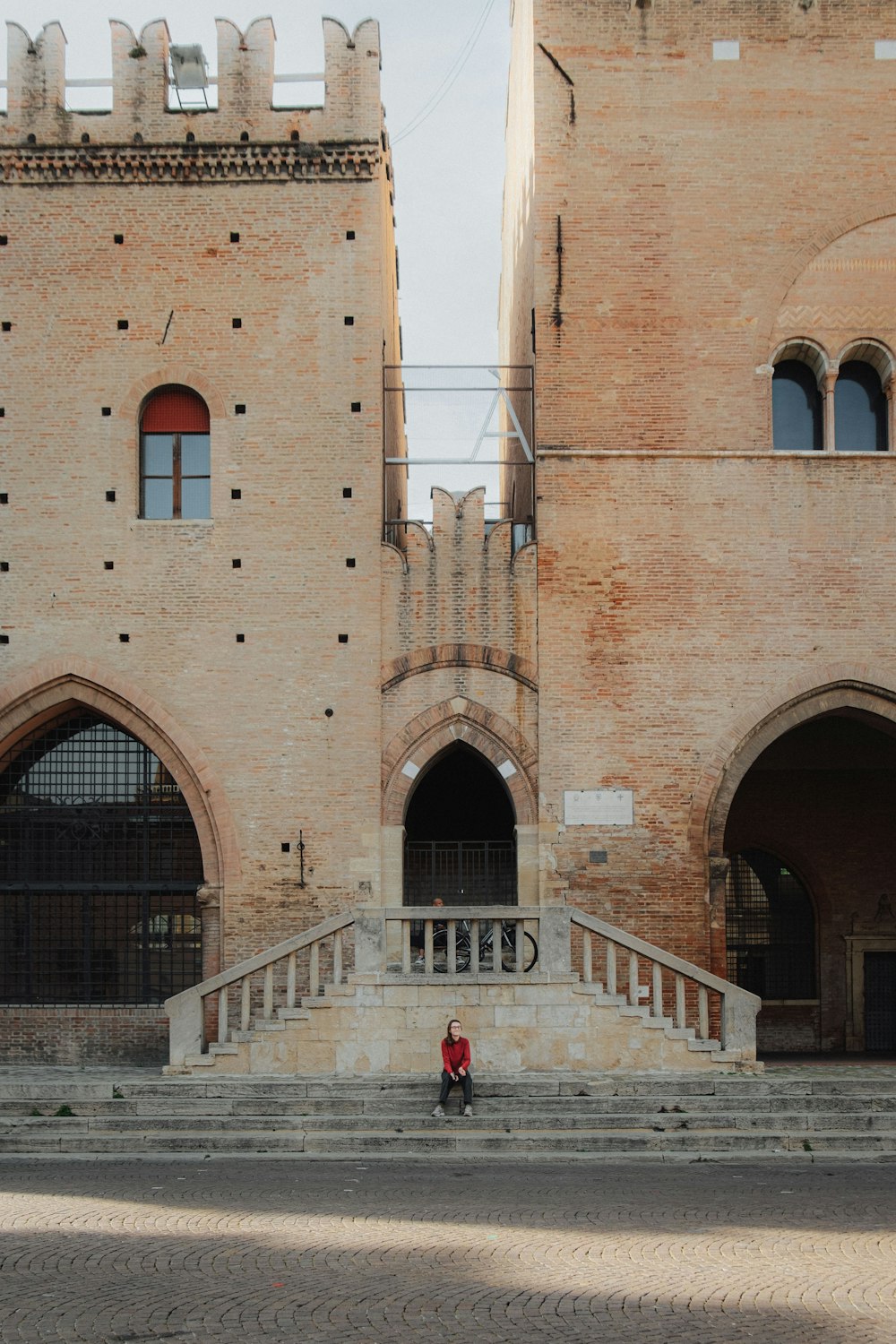 a person walking up a set of steps in front of a building