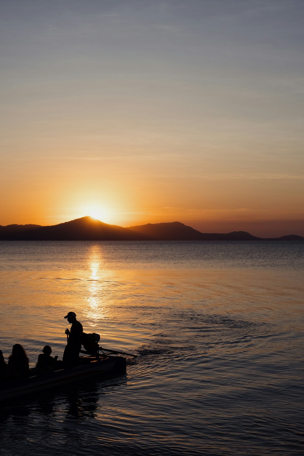 a group of people riding on the back of a boat