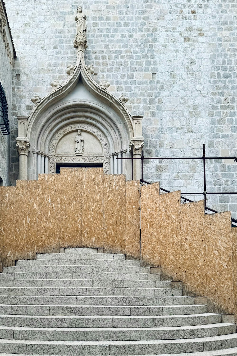 a stone building with a staircase leading up to it