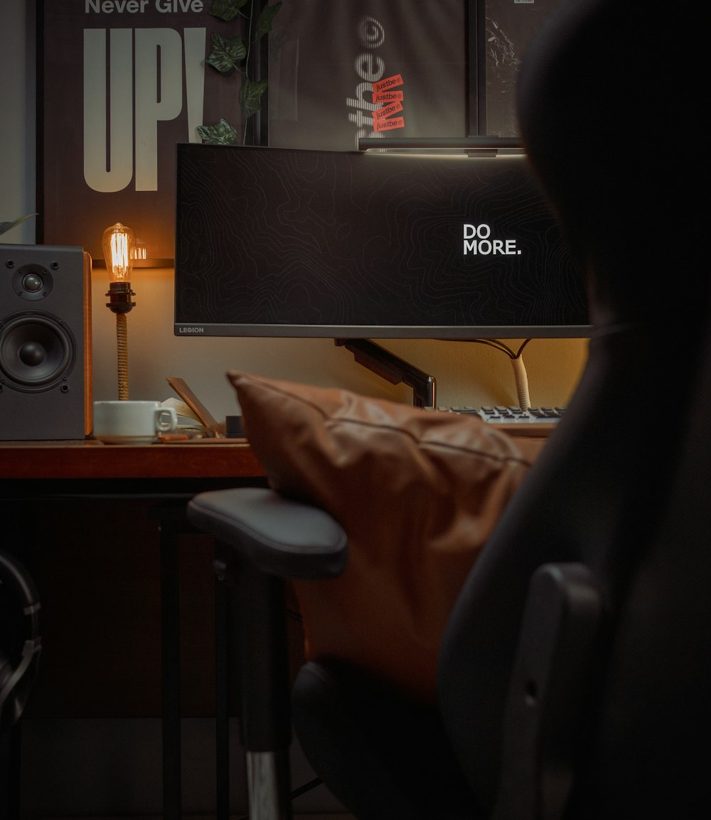 a computer monitor sitting on top of a desk