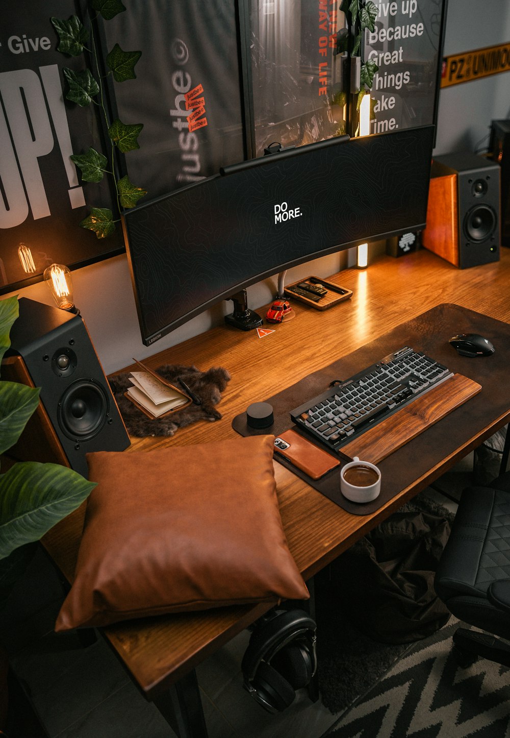 a computer desk with a keyboard and speakers