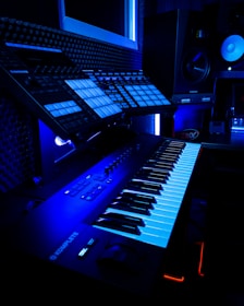 a computer keyboard lit up in a dark room