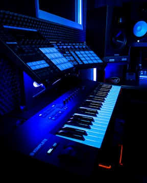 a computer keyboard lit up in a dark room