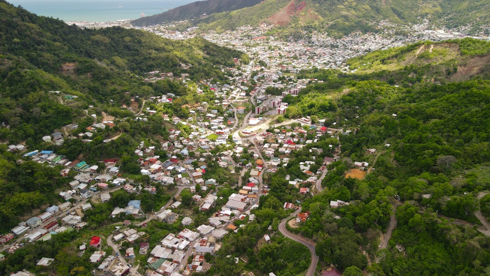 an aerial view of a small town in the mountains