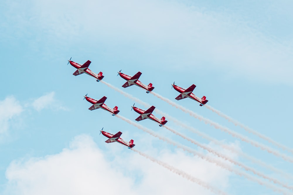 a group of airplanes flying in formation in the sky