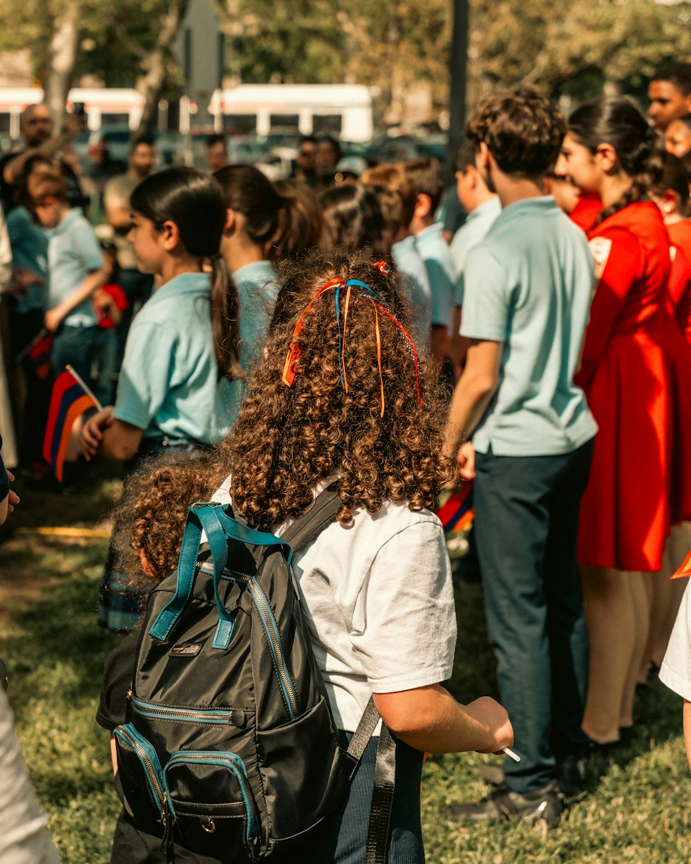 a group of people standing around each other