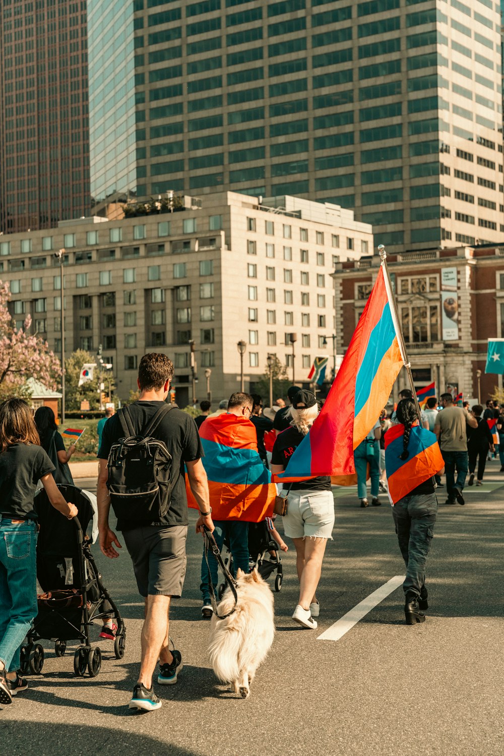 a group of people walking down a street