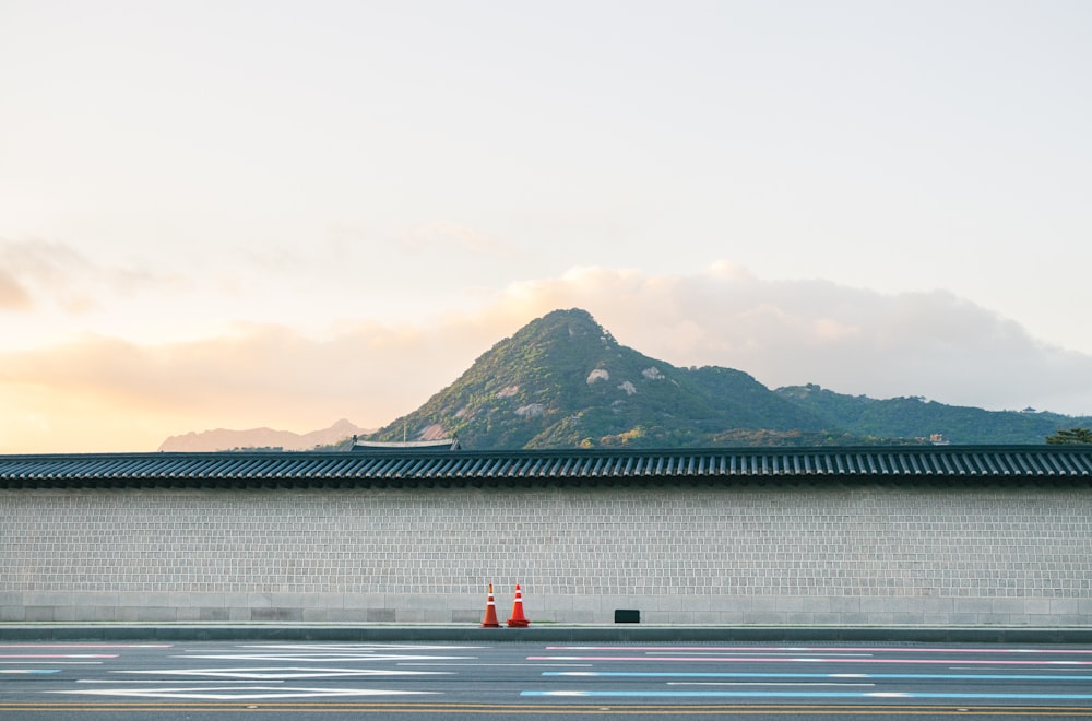 a building with a mountain in the background