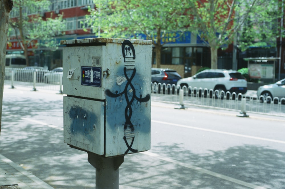 a street scene with focus on a mailbox