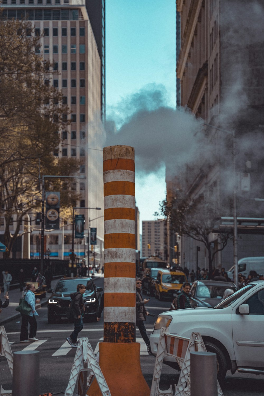 a city street with cars and people on it