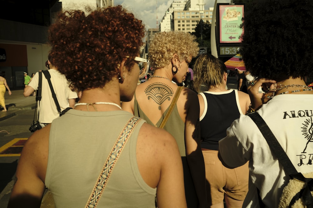 a group of people standing around each other