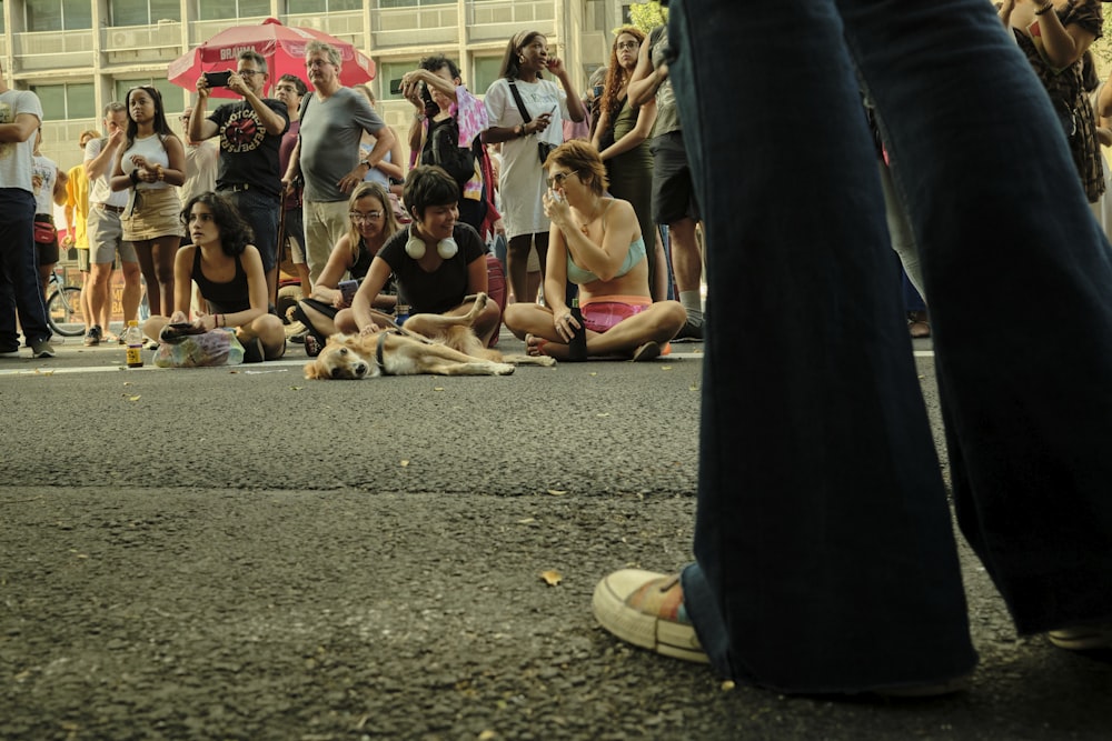 a group of people standing and laying on the ground