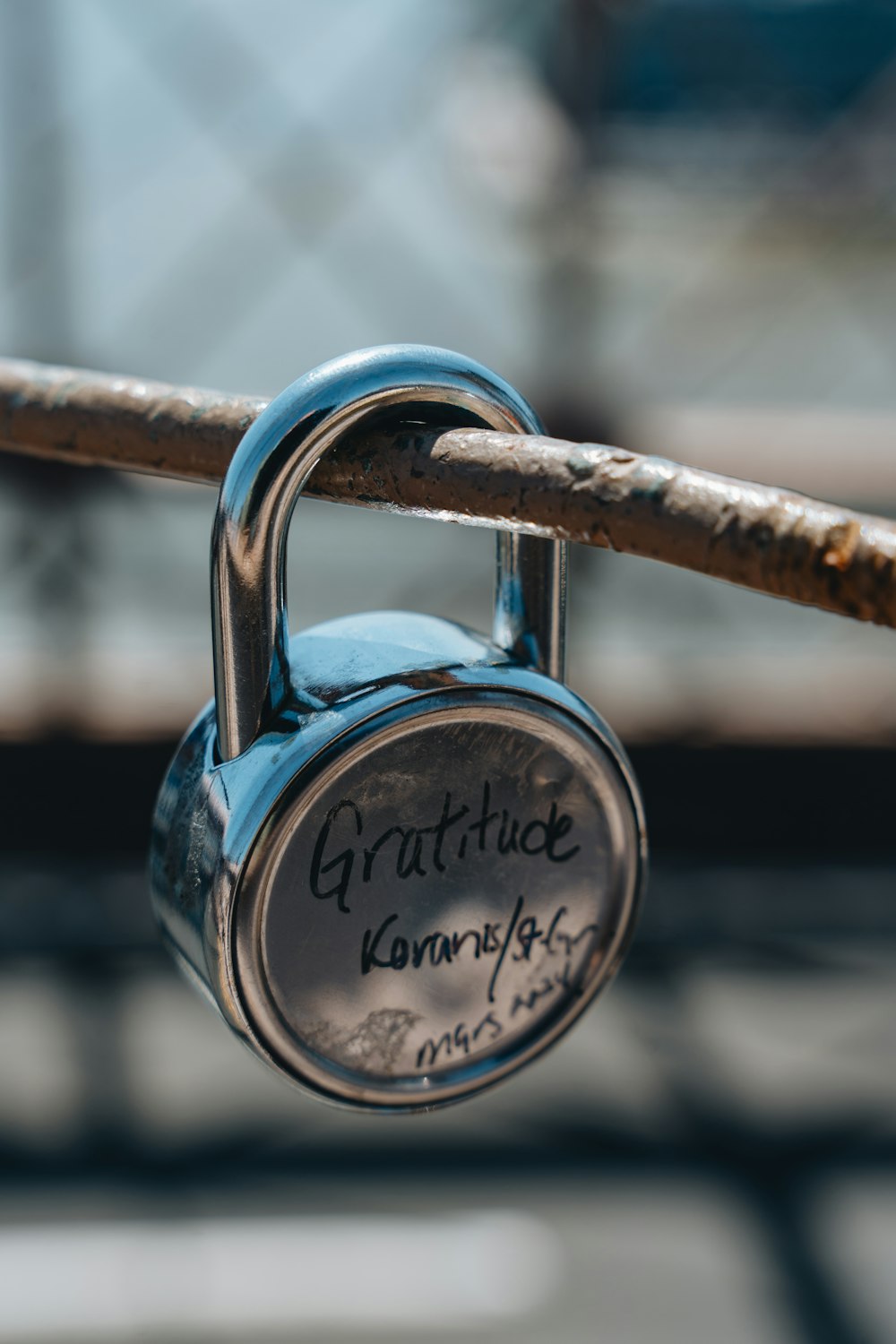 a close up of a padlock on a fence