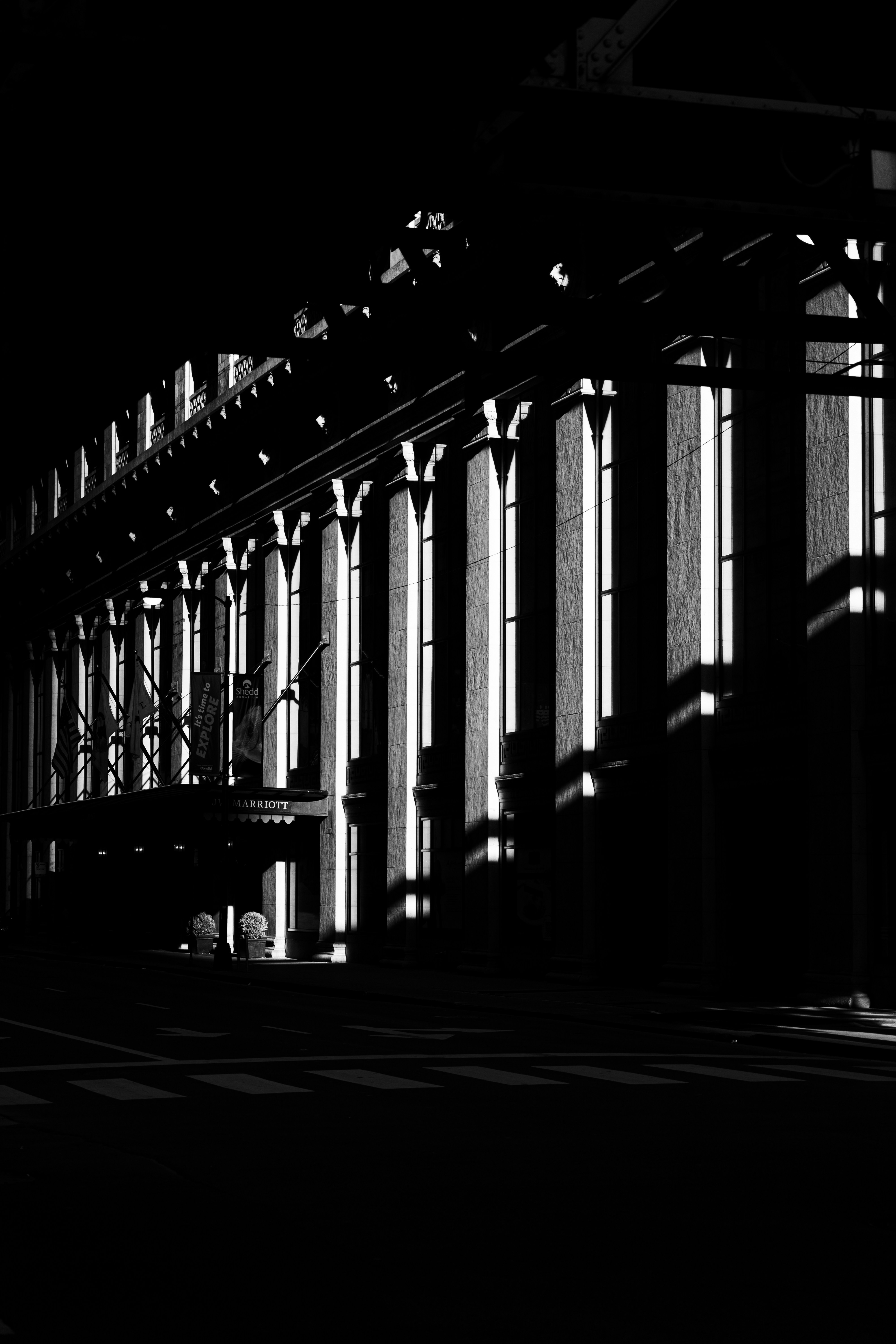 a black and white photo of a building at night