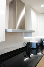 a stove top oven sitting inside of a kitchen