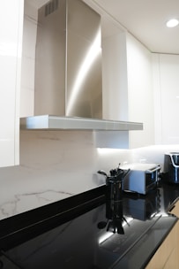a stove top oven sitting inside of a kitchen