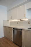 a kitchen with a dishwasher and a sink