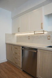 a kitchen with a dishwasher and a sink