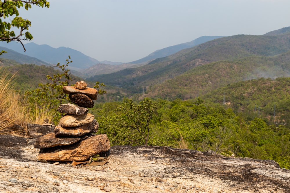 a stack of rocks sitting on top of a mountain