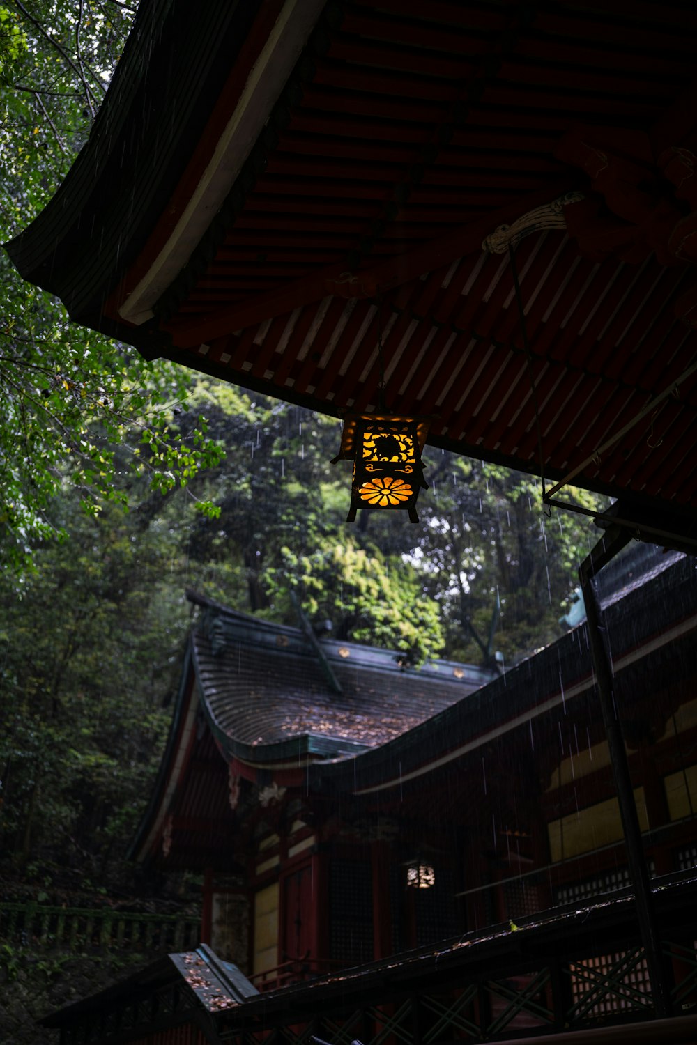 a lantern hanging from the roof of a building