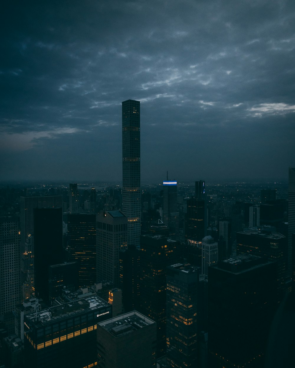 a view of a city at night from the top of a building