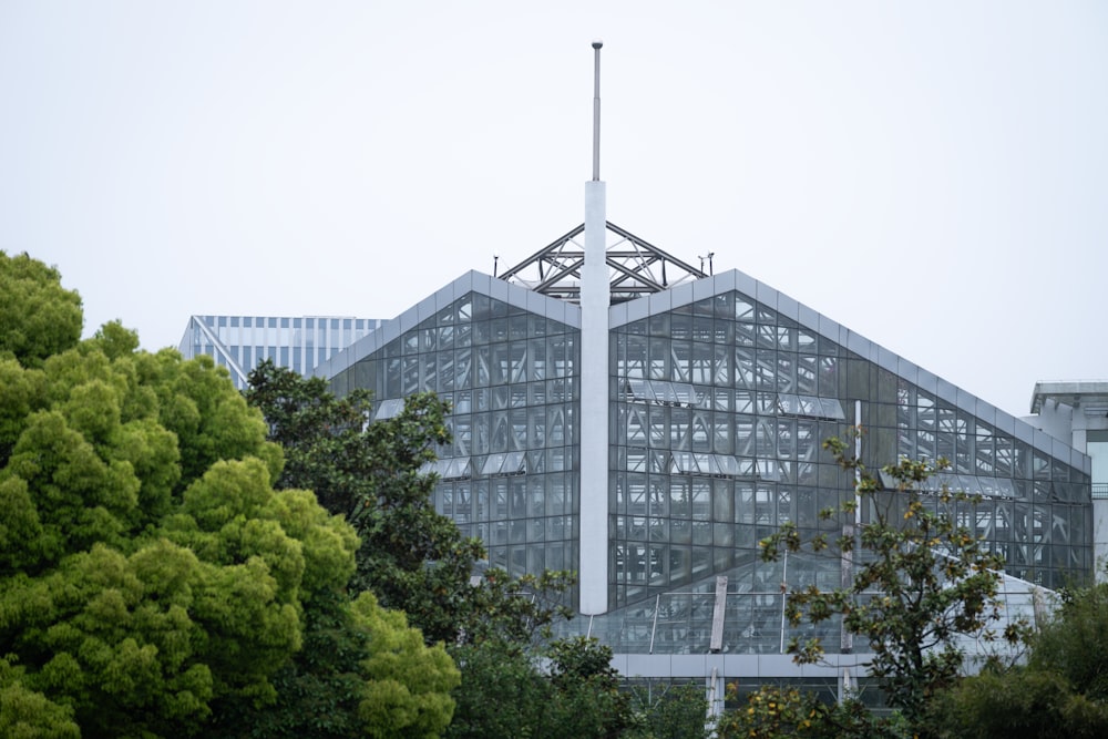 a tall building with a cross on top of it