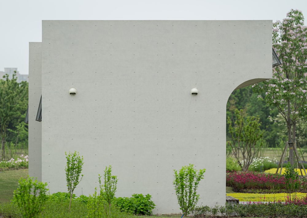 a white building with a clock on the side of it