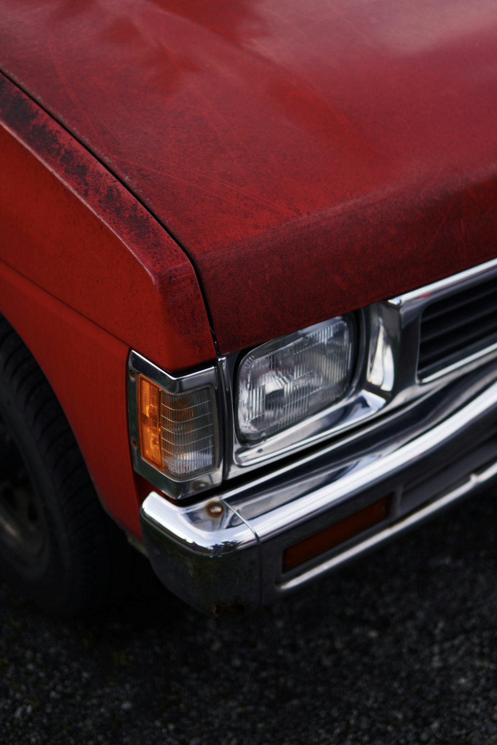 a close up of the front of a red car