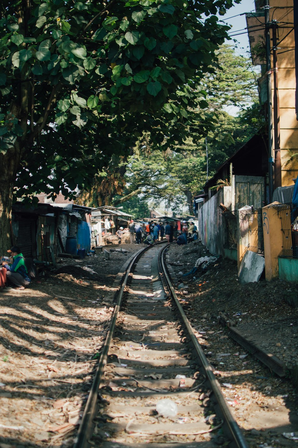 a train track running through a small village