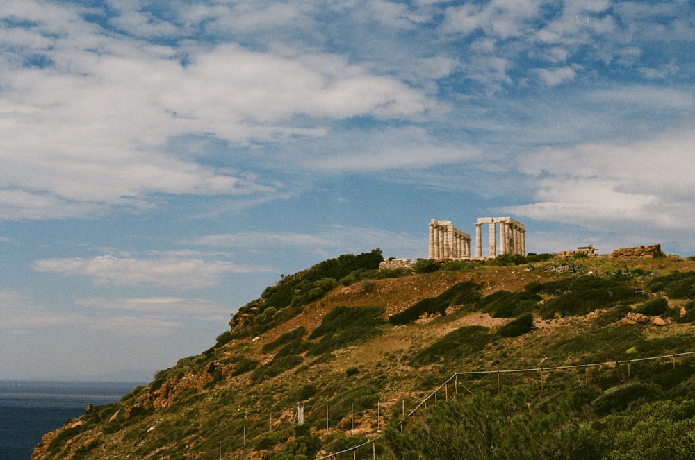 a very tall building on top of a hill