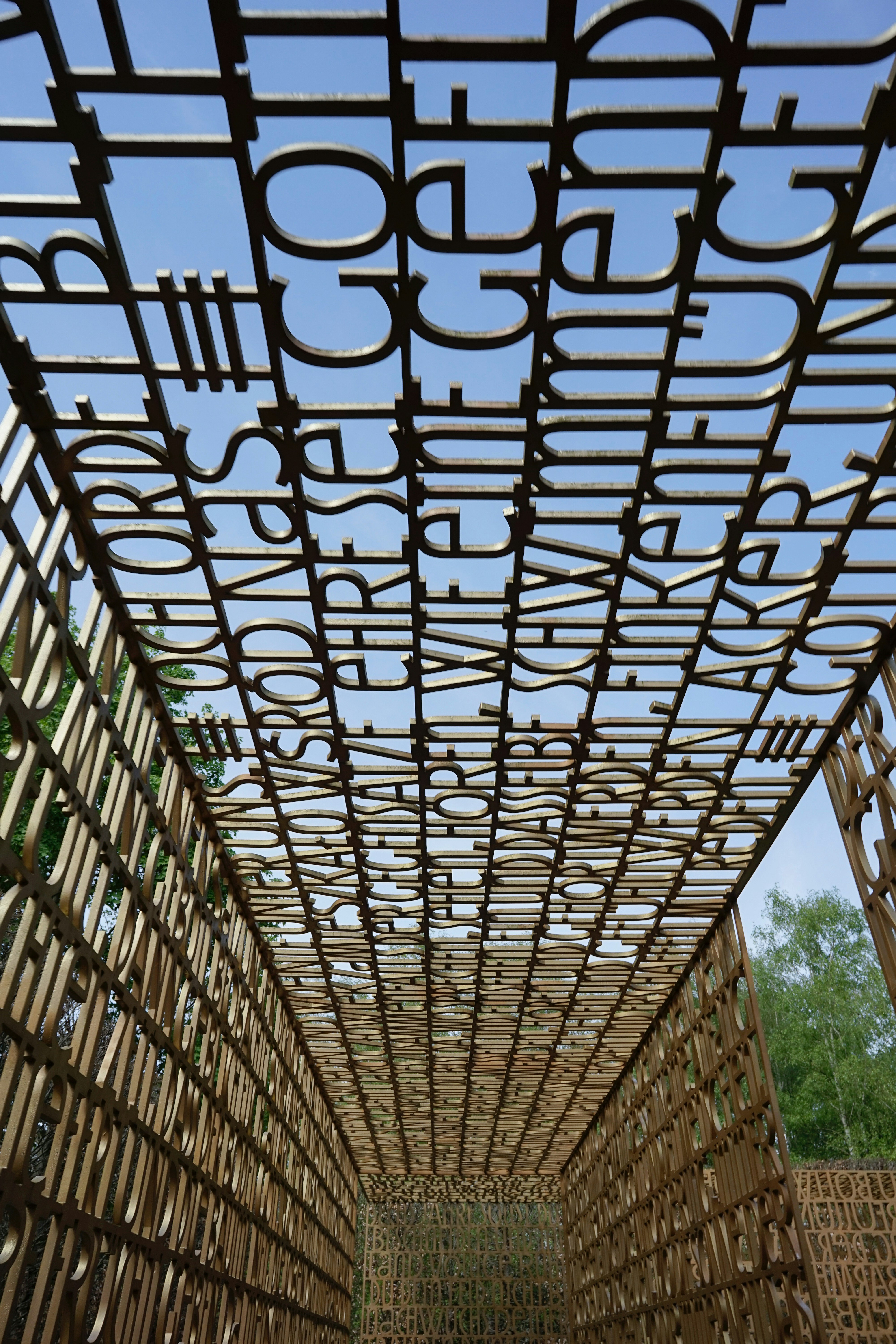 a wooden structure with a sky in the background
