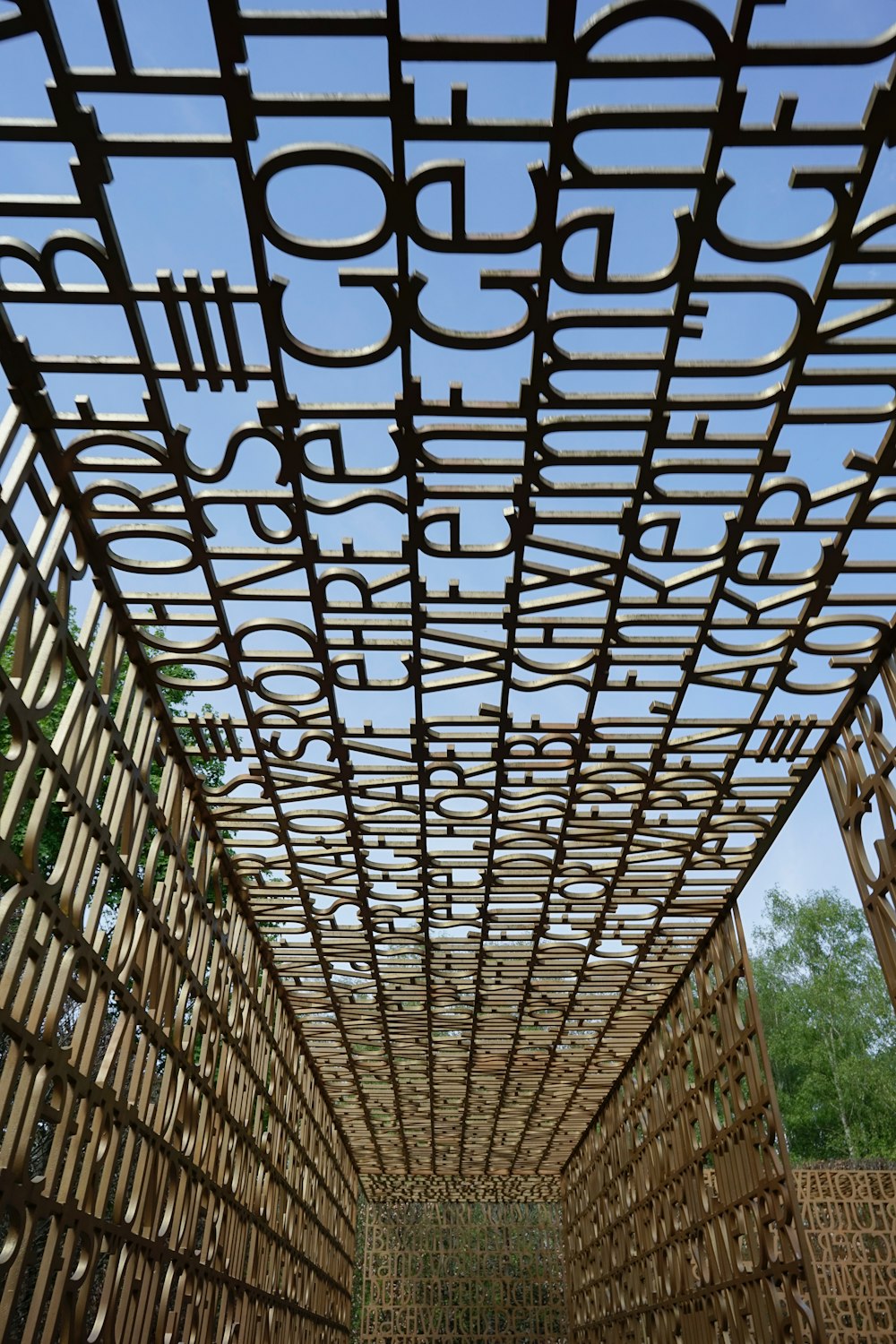 a wooden structure with a sky in the background