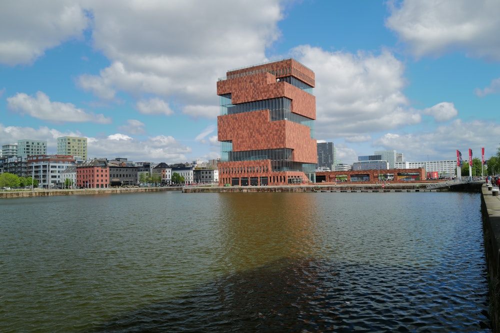 a body of water with a building in the background