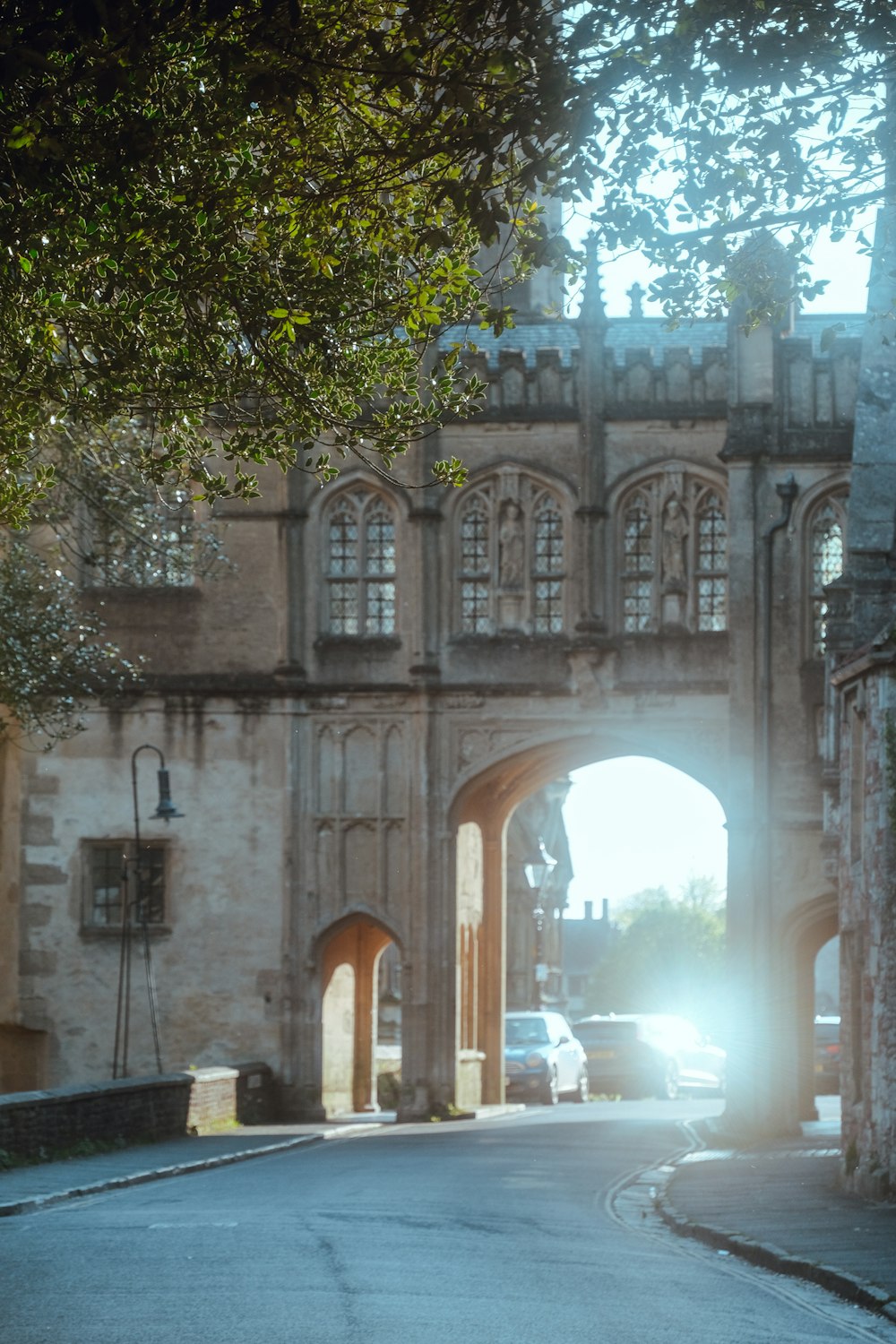 a car is parked in front of an old building