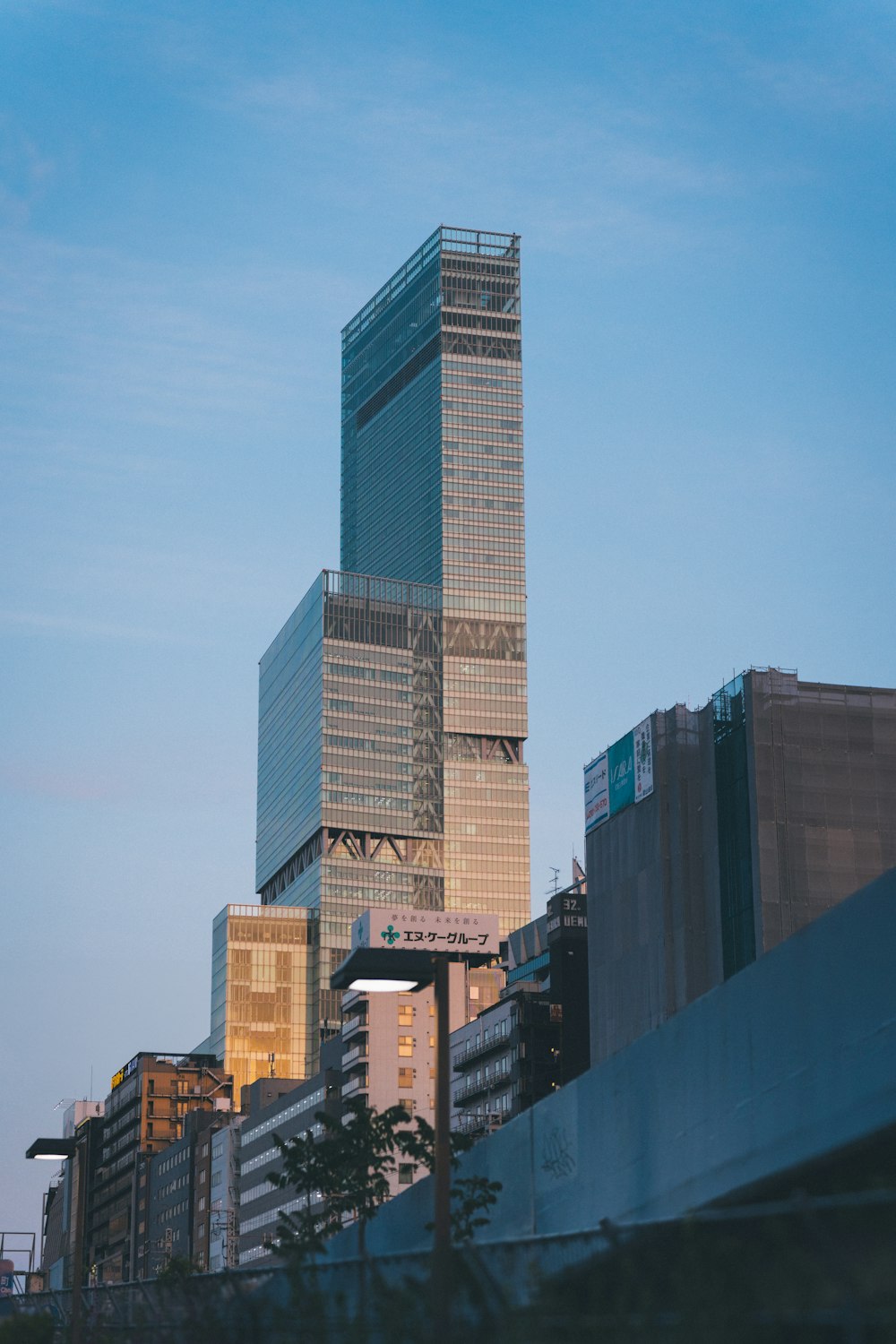 a very tall building towering over a city