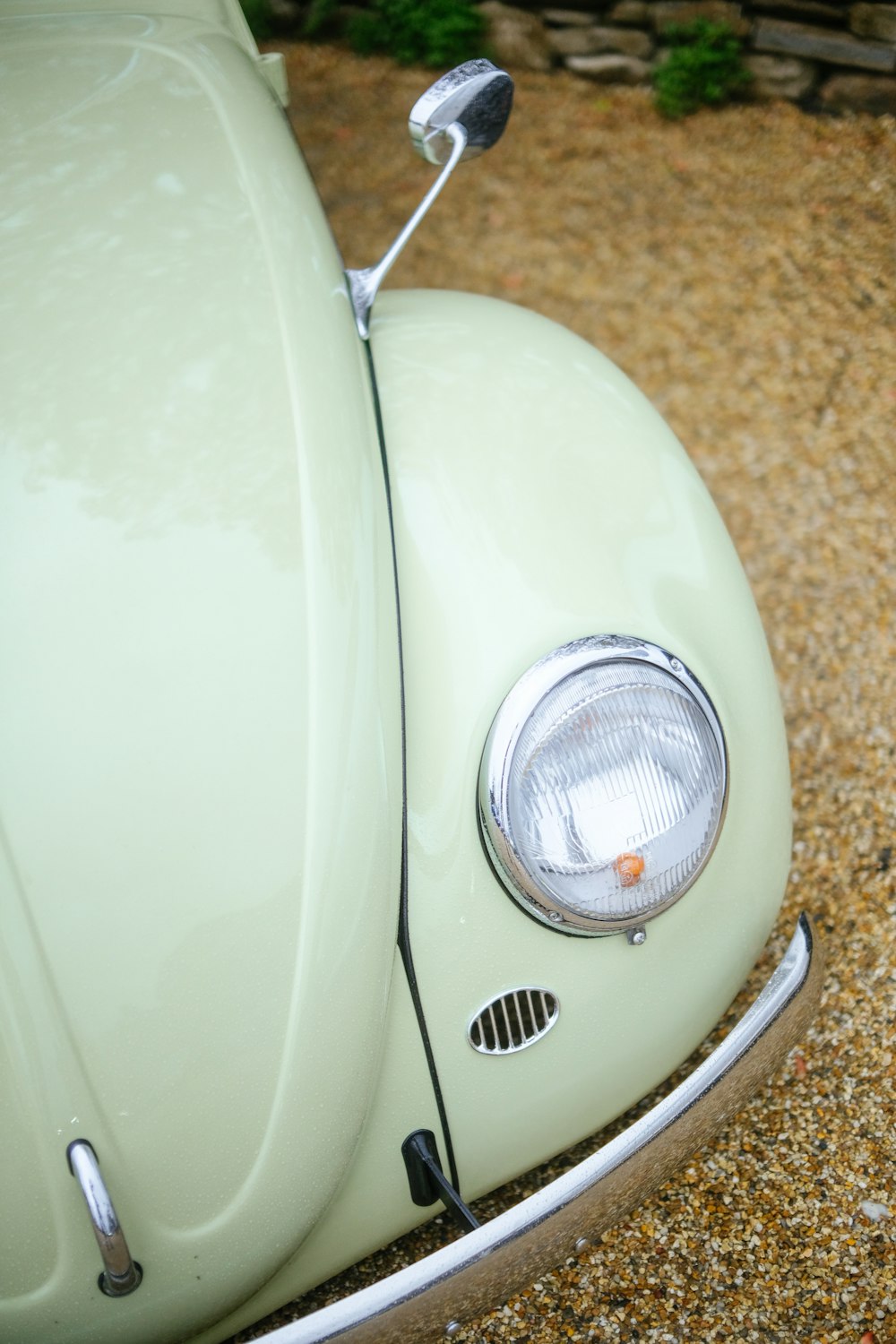 a close up of the front end of a green car