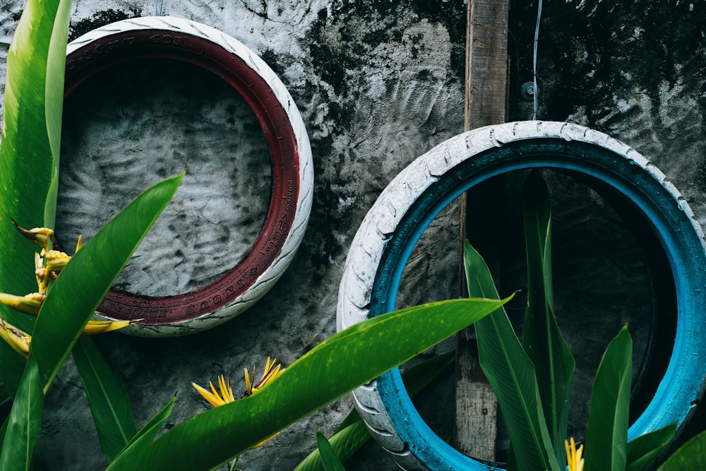 a couple of tires sitting on top of a cement wall