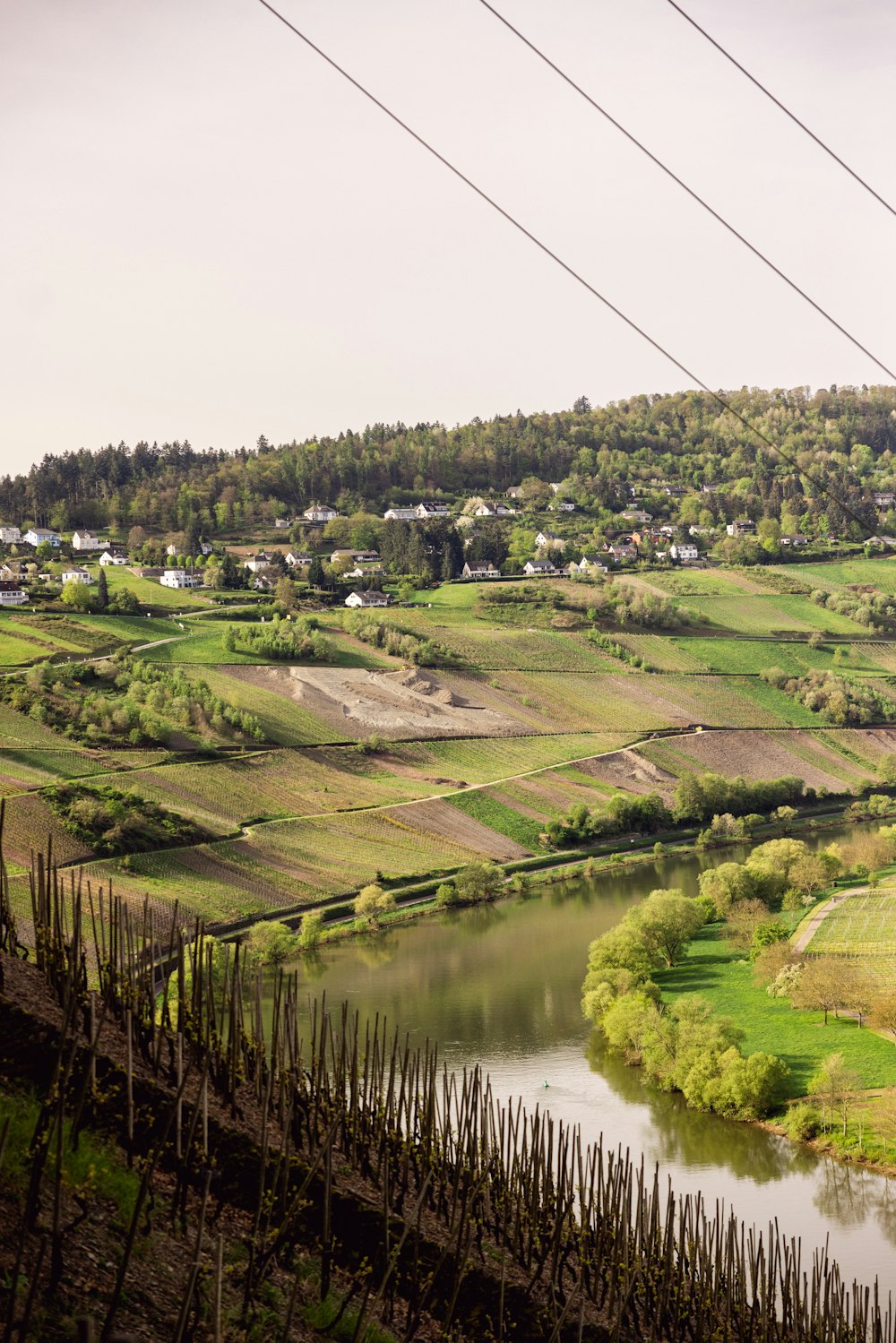 a river running through a lush green countryside